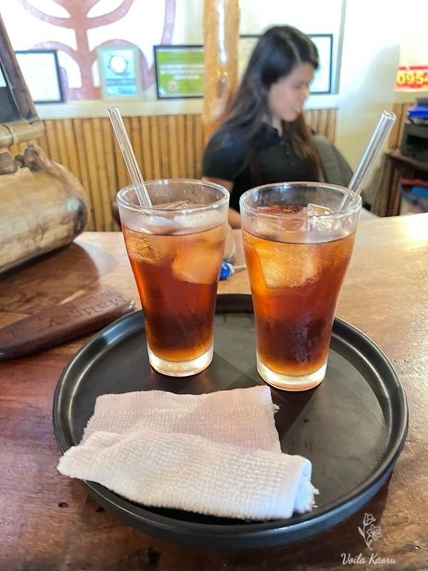 Two glasses of welcome tea on a tray at Maligaya Beach Bungalows reception