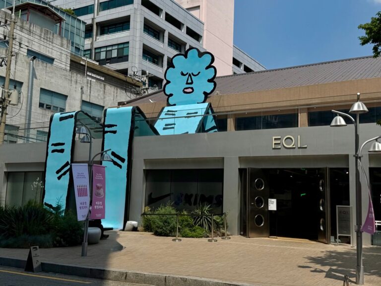 EQL storefront in Seongsu with a large turquoise figure above the entrance, photographed during an earlier visit