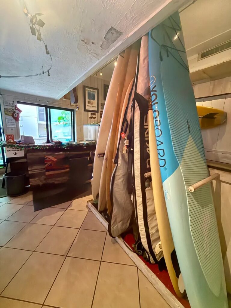 Surfboards stored upright inside Ty Gurney Surf School in Waikiki